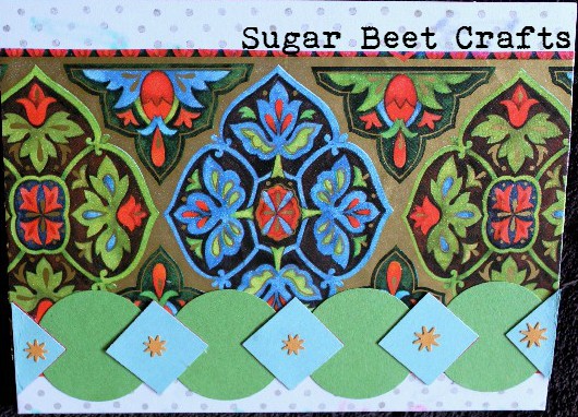 Vintage Wrapping Paper and construction paper scraps were used for this card..along with some stamps