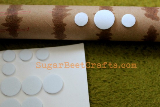 Apply foam disks to cardboard roller.